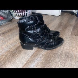 Black buckled boots
